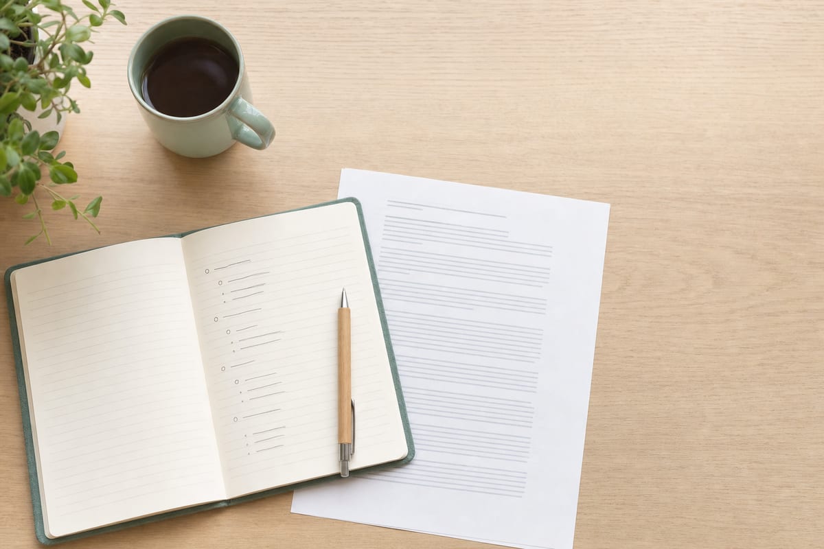 Classification Essay — open notebook with a short outline in pencil
