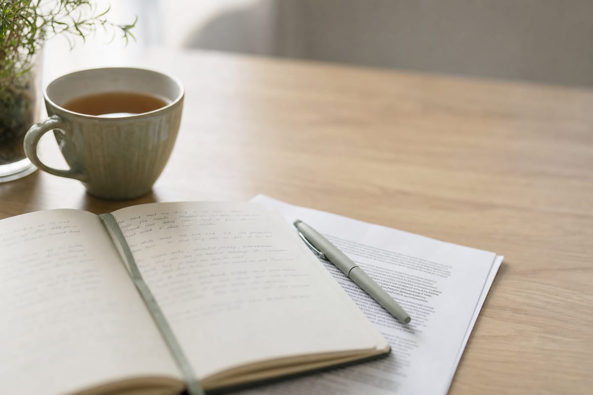 Consideration — open notebook with handwritten notes